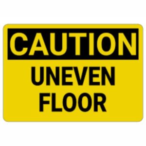 "Warning sign for uneven floor surface in commercial building"