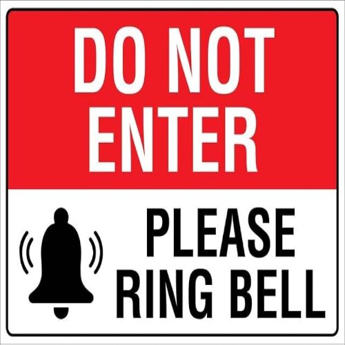 Professional "Please Ring The Bell" sign at a counter in a Nigerian hotel