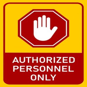 Wall-mounted "Authorized Personnel Only" sign in Nigeria.