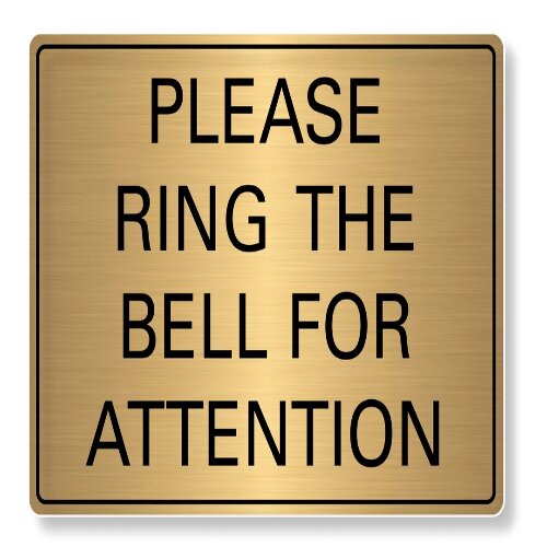Clear reception desk with a "Ring Bell for Service" sign in a Nigerian office.