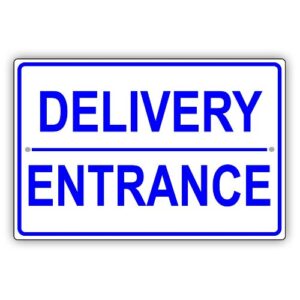 Large "Delivery Entrance" sign guiding trucks at a Lagos warehouse.