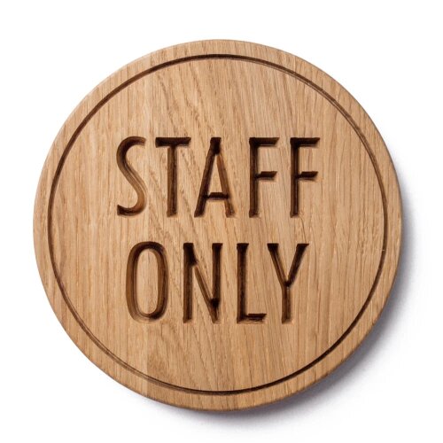 Prominent "Staff Access Only" sign in a Lagos healthcare facility.
