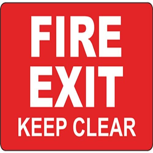 "Fire Exit Access - Keep Clear" sign on a critical pathway in Lagos.