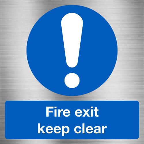 Durable "Fire Exit - Keep Clear" signage on a warehouse door in Nigeria.