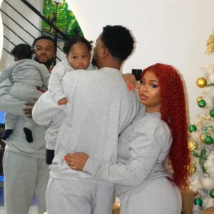 Family wearing Christmas sweaters vendor in Nigeria